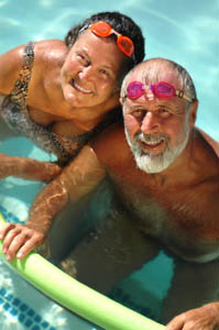 elderly couple swimming