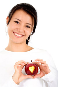 woman holding apple