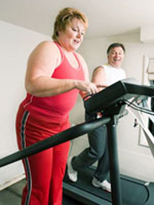 overweight couple on treadmill