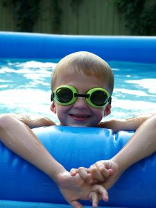boy swimming with goggles