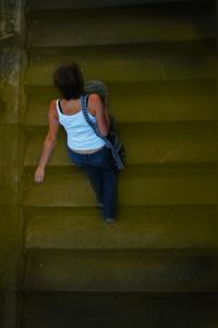 woman climbing stairs