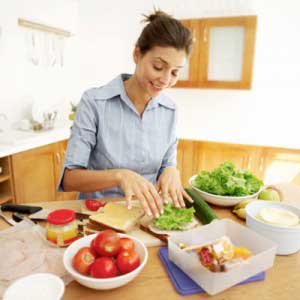 woman making healthy lunch