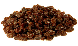 raisins in a pile on a white background