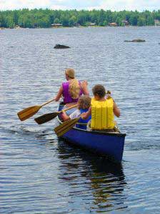 campers rowing a boat
