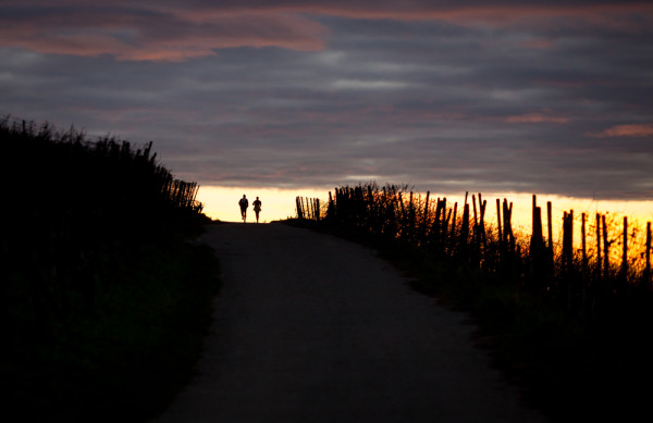 Couple running sunset